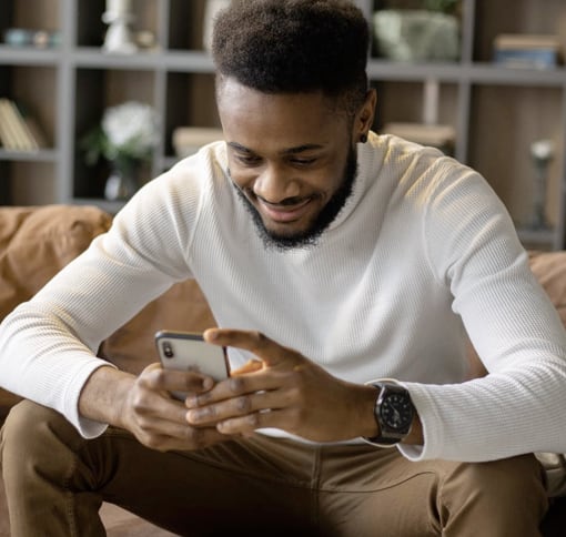 Man Sitting and Texting